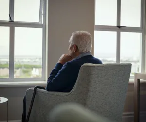 an elder facing the window