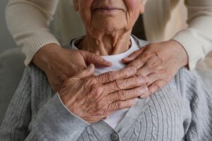 A woman embracing an older nursing home resident. You can learn more about how bedsores can be prevented in nursing home residents today.